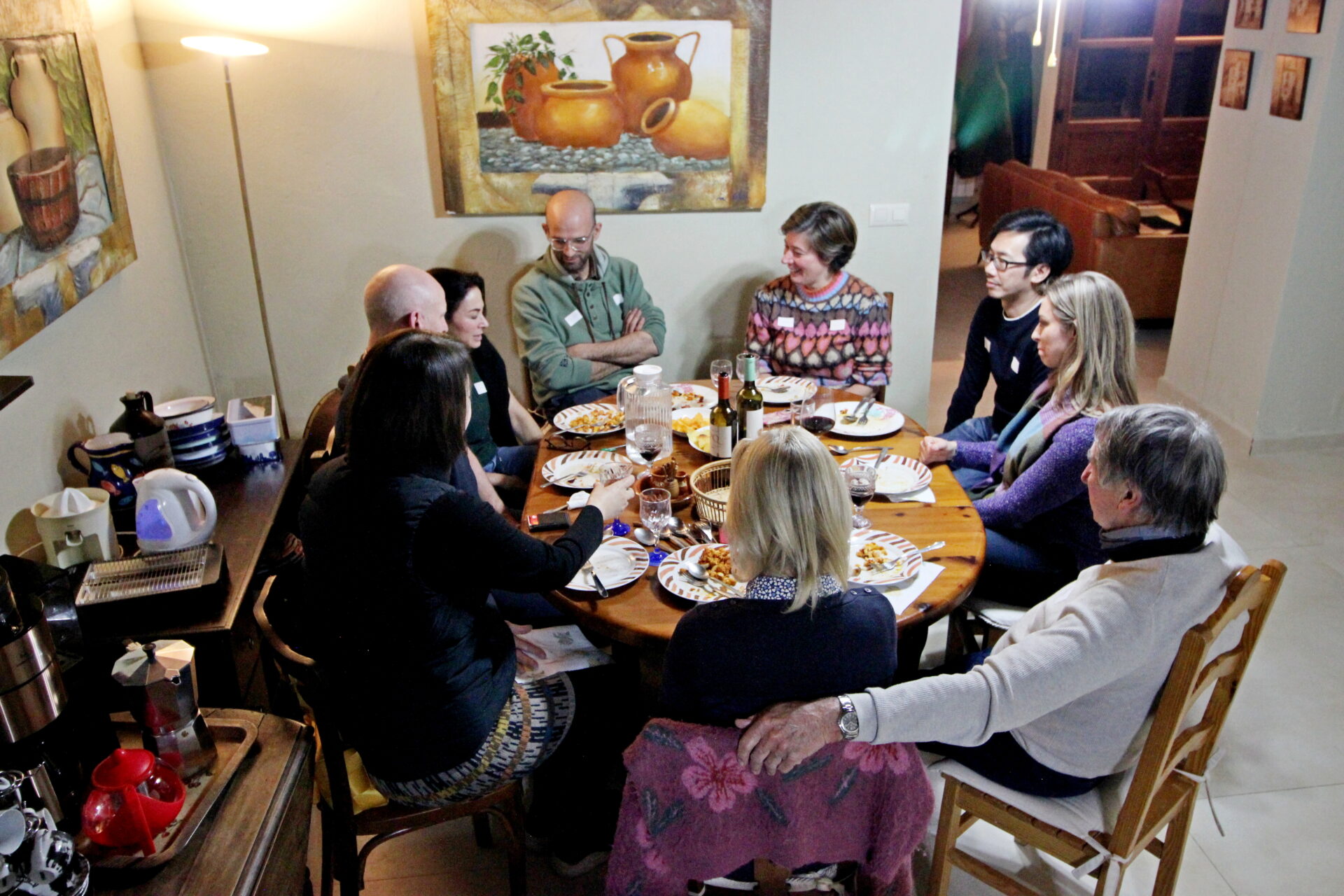 People dining around a table at home.