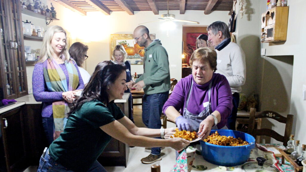 Group enjoying cooking together in a kitchen