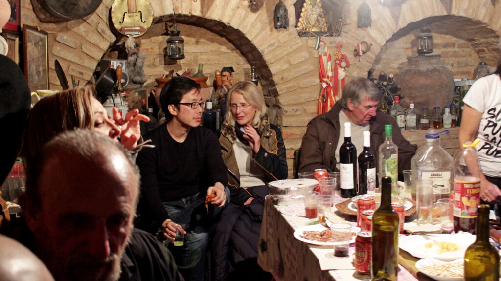 People enjoying a meal in rustic setting